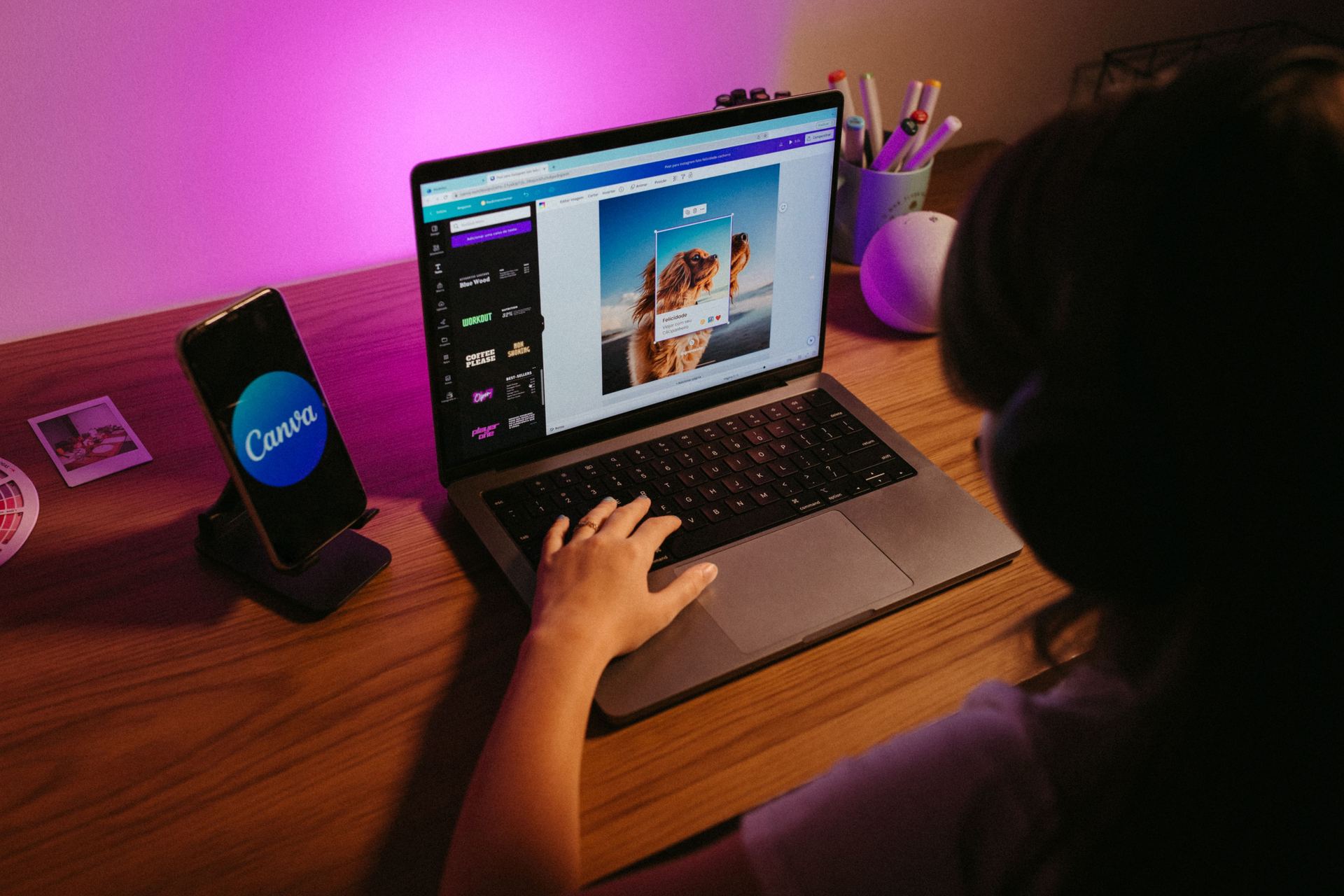 Student creating social media graphics on a laptop