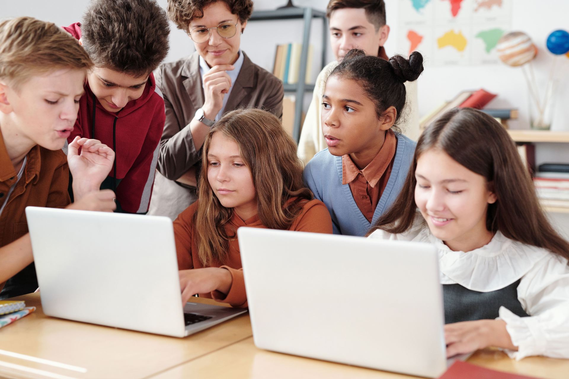 Teen students collaborating on a digital brand project